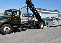 Reis Trucking roll-off truck with container